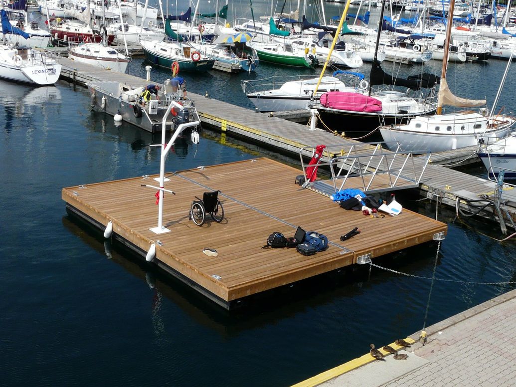 Docks floated to site & attached